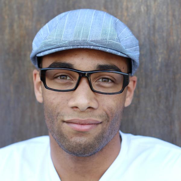 Headshot of a man wearing glasses.
