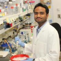 Picture of Aman George in the lab 