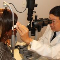 Doctor giving eye exam