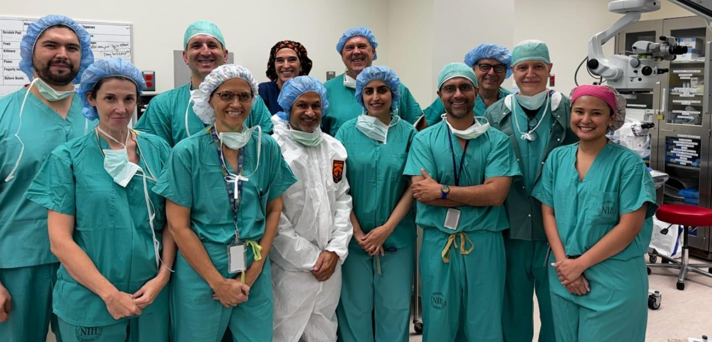 Dr Bharti with group dressed in scrubs