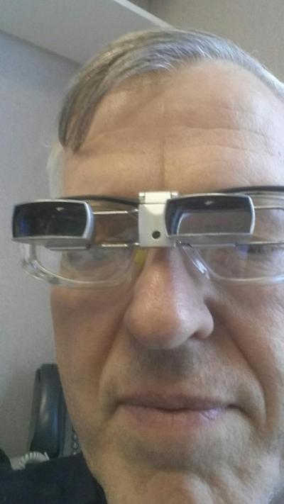 Man wearing prism glasses