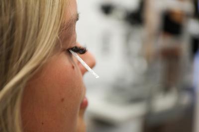 patient with paper strip in eye