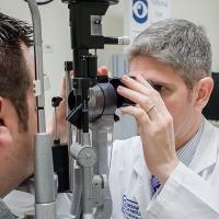 A person being examined by an eye doctor