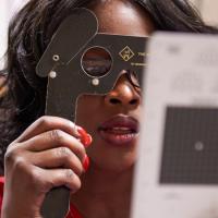 Woman reading eye chart 